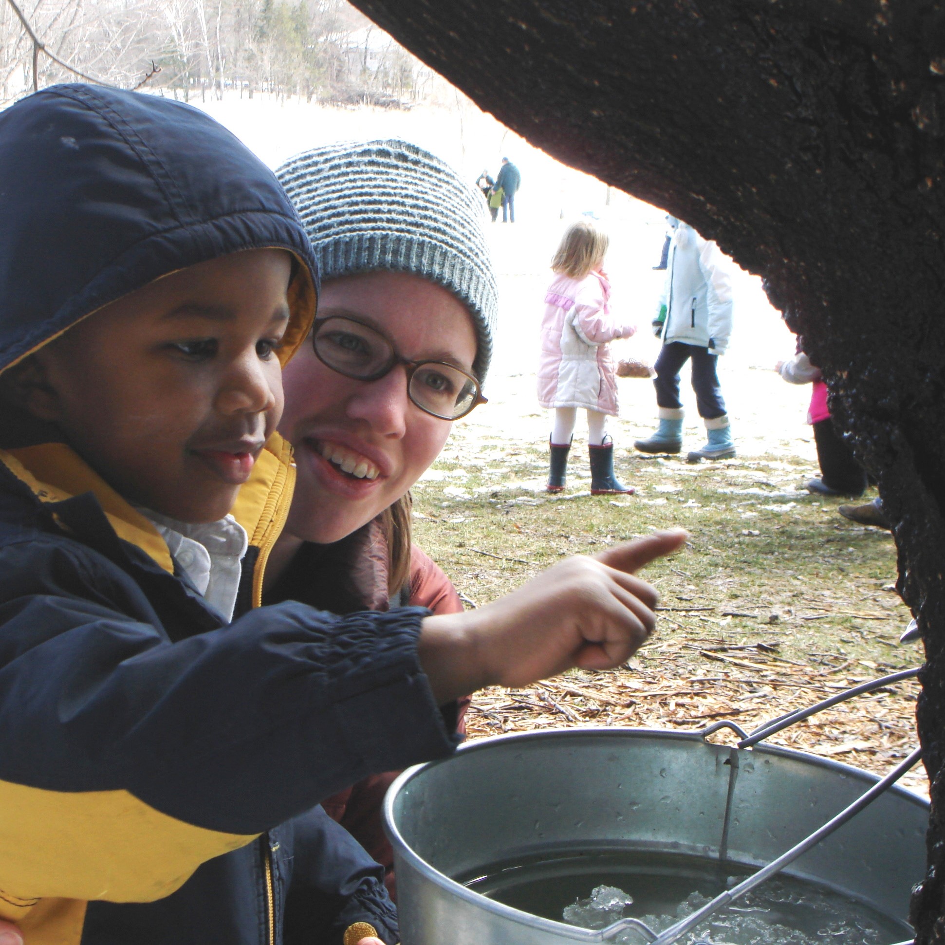 Boy tasting sap